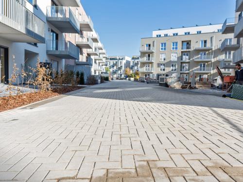 Newly installed green areas and walkways within a residential complex.